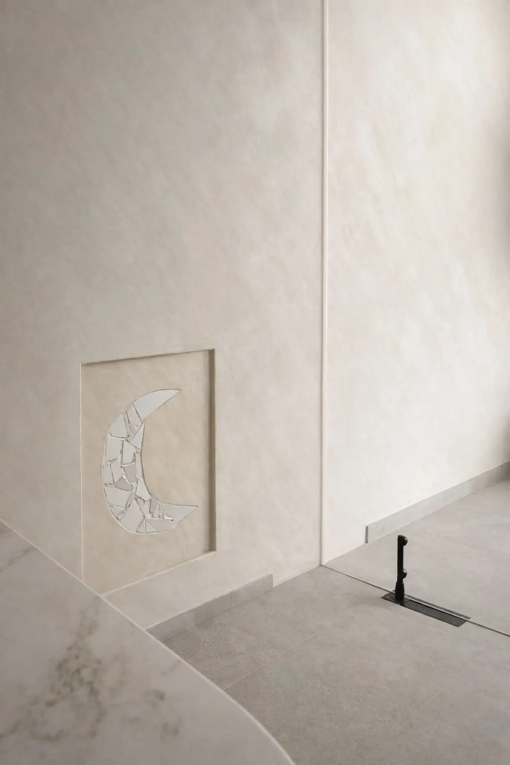 The Moon Stone set into the reception wall at Luna Residences